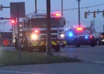 Man apprehended after jumping on top of a semi and fire truck in Cleveland